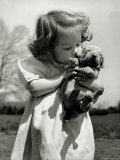 Christina Goldsmith Kissing a Weimaraner Puppy from Her Father's Stock of Weimaraner Hunting Dogs Photographie par Bernard Hoffman
