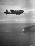 F-6 Hellcat Fighter Plane over Tanahmera Bay as Japanese Airfields at Hollandia, New Guinea Premium Photographic Print by J. R. Eyerman