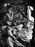 Helicopter Crew Chief James C. Farley Shouting to Crew as Wounded Comrades Lay Dying at His Feet Premium Photographic Print by Larry Burrows