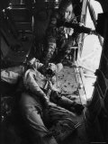 Helicopter Chief James C. Farley Working Jammed Machine as Pilot Lt. James Magel Dying Beside Him Photographic Print by Larry Burrows