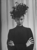 Austine Cassini Standing with Arms Crossed and Wearing Extravagant Hat Premium Photographic Print by Marie Hansen