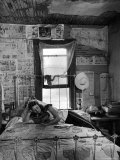 Farmer's Daughter Delphaline, Reading a Book as She Lies on Iron Bed in Her Bedroom Premium Photographic Print by Alfred Eisenstaedt