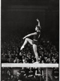 Russian Gymnast Larisa Latynina Competing on the High Beam in the Olympics Premium Photographic Print by John Dominis