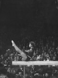 Russian Gymnast Larisa Latynina Competing on the High Beam at the Olympics Premium Photographic Print by John Dominis