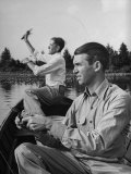 Jimmy Stewart Bass Fishing in Lake Near His Home with Friend Clyde Woodie Woodward Premium Photographic Print by Peter Stackpole