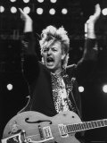 Guitarist for Stray Cats Rock Group Brian Setzer with Guitar, Screaming Song on Stage Premium-Fotodruck von Kevin Winter