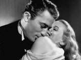 Gregory Peck Embracing Ann Todd in Publicity Still for Alfred Hitchcock's Film "The Paradine Case." Premium Photographic Print