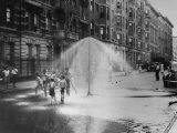 Children Running Around under Sprinkler in Street to Cool Off During Summer, in South Harlem Photographic Print