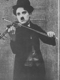 Charlie Chaplin as a Street Musician in The Vagabond Reproduction photographique sur papier de qualité