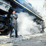 Country Music Star Johnny Cash Wearing Black Clothing and Standing in Front of a Locomotive Premium Photographic Print by Michael Rougier
