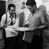 Director Walt Disney Looking over Sketches from His Latest Picture "Pinocchio." Reproduction photographique sur papier de qualité par Peter Stackpole