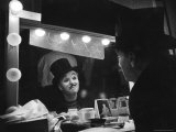 Charlie Chaplin Looking Into Mirror, Putting on Makeup for Role as the Animal Trainer Reproduction photographique sur papier de qualité par W. Eugene Smith