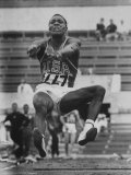 Rafer Johnson in Decathlon Broad Jump in Olympics Premium Photographic Print by James Whitmore