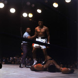 Heavyweight Boxer Cassius Clay, aka Muhammad Ali, Standing over Opponent Sonny Liston Premium Photographic Print by George Silk