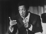 Comedian Bill Cosby Holding Mike as He Performs on Stage Reproduction photographique sur papier de qualité par Michael Rougier