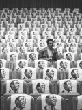 Comedian Bill Cosby Sitting in Empty Auditorium Filled with Copies of His Likeness on Each Seat Reproduction photographique sur papier de qualité par Michael Rougier