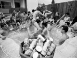 Pair of Couples "Chicken Fighting" in a Crowded Jacuzzi Pool During a Beer Fueled Party Premium Photographic Print by Arthur Schatz
