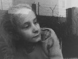 Girl Gazing Pensively Through Pane of Her Apartment Window, Grimly Reflects Image of Berlin Wall Premium Photographic Print by Paul Schutzer