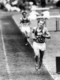 Distance Champion Emil Zatopek as He Set a New 10,000 Meter Record During the Olympic Games Premium Photographic Print by Frank Scherschel