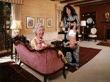 Grace Slick Holding Her Daughter Upside Down by the Ankles Premium Photographic Print by John Olson