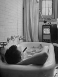 Writer Russell Finch Taking Portable Television Set to Bathroom During His Bath Premium Photographic Print by George Skadding