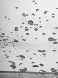 Scores of Paratroopers Dropping from C-82 "Flying Boxcar" and Landing on Level Ground Photographic Print by Frank Scherschel