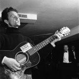 Folk Singer Woody Guthie Performing with Guitar Emblazoned with Folk Singer Woody Guthie Performing with Guitar Emblazoned with