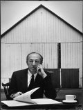 Composer Arron Copland Sitting at Table with Score in Front of Barn Reproduction photographique sur papier de qualité par Gordon Parks