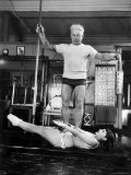 Opera Singer Roberta Peters Balancing Her Trainer, Joseph Pilates, on Her Operatic Breadbasket Premium-Fotodruck von Michael Rougier