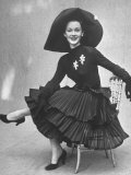Model Showing Skirt Featuring Tiers of Ruffles Completed with Long Sleeved Top and Picture Hat Photographie par Gordon Parks