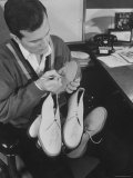 Pop Singer Pat Boone Autographing His White Buck Leather Shoes for Charity Reproduction photographique sur papier de qualité par Ralph Morse