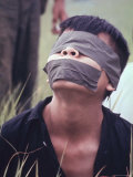 Viet Cong Prisoner Captured During Cape Batangan Battle, Awaiting Transfer to US POW Compound Photographic Print by Paul Schutzer Viet Cong Prisoner Captured During Cape Batangan Battle, Awaiting Transfer to US POW Compound Photographic Print by Paul Schutzer