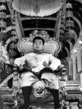 King Norodom Sihanouk of Cambodia Sitting in His Throne Wearing "Sampots", Sarong Style Pants Premium Photographic Print by Howard Sochurek
