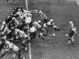 The Green Bay Packers Playing a Game Premium-Fotodruck von George Silk