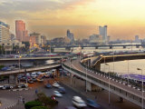 A Traffic Jam at Sunset on One of Cairo's Bridges Spanning the Nile River, Egypt, May 20, 2001 Photographie par Enric Marti