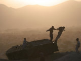 Children Play on Top of a Destroyed Tank Photographic Print by Rodrigo Abd