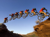 Mountain Biker Catches Air at Rampage Site near Virgin, Utah, USA Photographie par Chuck Haney