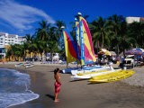 Woman and Yachts on Beach, Westin Regina Resort, Puerto Vallarta, Mexico Photographic Print by Richard Cummins