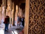 Carved Wall with Tourists in Background, Alhambra, Granada, Spain Photographic Print by John Banagan