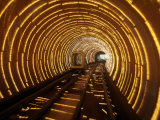 An Empty Tourist Subway Car Runs Through Illuminated Tunnel Photographic Print