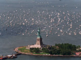 Small Sailing Ships and Pleasure Boats are Moored Near the Statue of Liberty Photographic Print