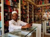 Perfume Shop Owner in Old Souq, Kuwait Photographic Print by Mark Daffey