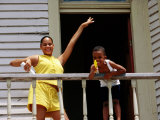 Young Girl and Boy on Balcony, Galveston, U.S.A. Photographic Print by Oliver Strewe