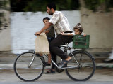 Palestinian Man, 28, Takes His Son, 4, and Daughter, 2, on His Bicycle Photographic Print