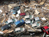 Cars are Piled up Among Debris from Hurricane Katrina Photographic Print