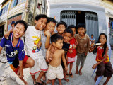 Group of Children in Street, Kampot, Cambodia Photographic Print by Christopher Groenhout