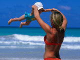 Mother Swinging Baby on Varadero Beach, Varadero, Cuba Photographic Print by Philip Smith