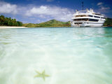 Blue Lagoon Cruises Ship and Starfish in Water, Fiji Photographic Print by Peter Hendrie