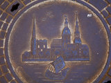 Latvia, Riga, Manhole Cover in Street, Close-up Photographic Print by Keenpress 