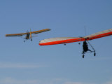 Hang Glider Being Towed Aloft by an Ultralight Aircraft Lámina fotográfica